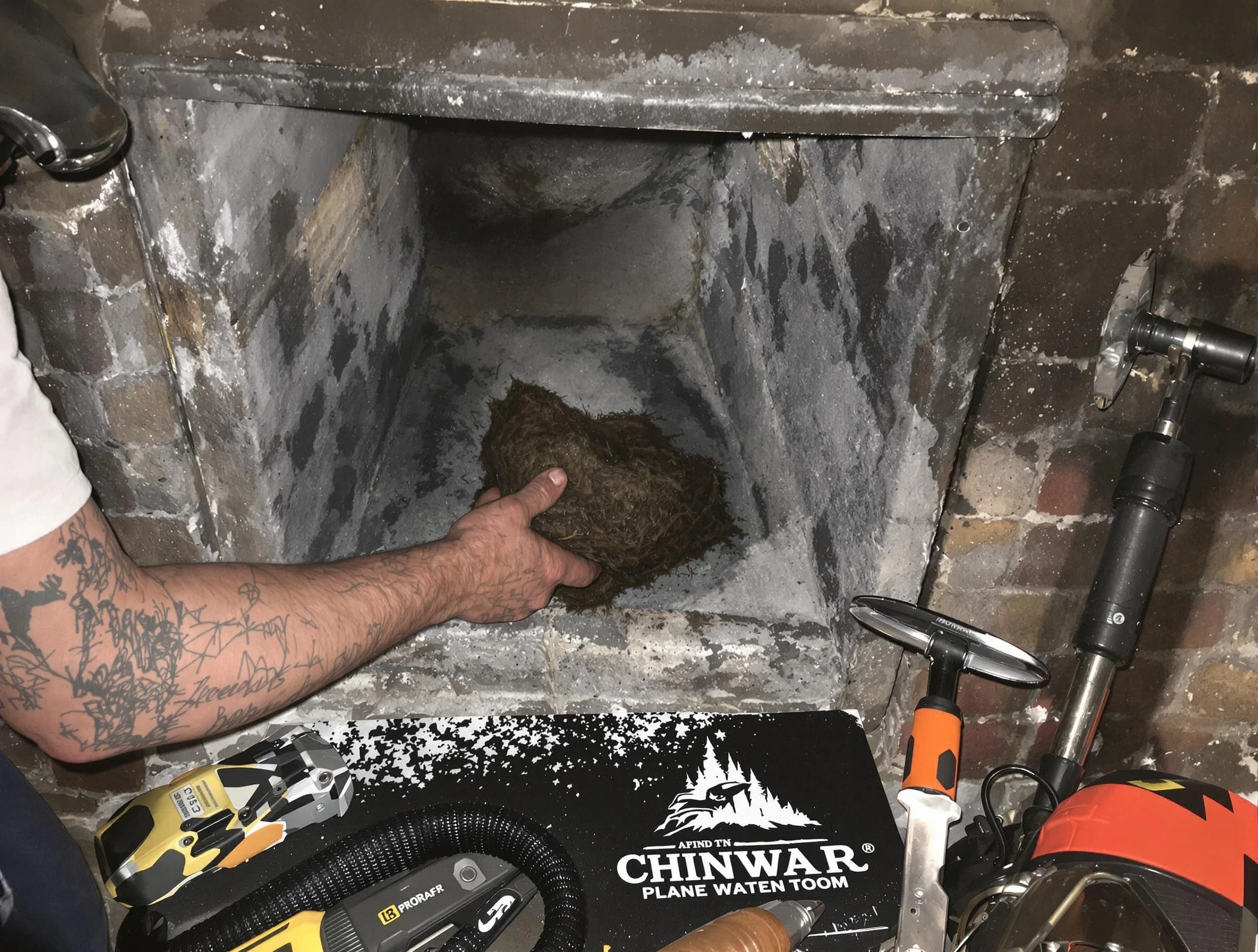 Alpharetta Chimney Sweep safely removing debris and screening chimney in Alpharetta, GA